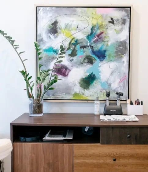 Results Medical Aesthetics waiting area with abstract art and greenery