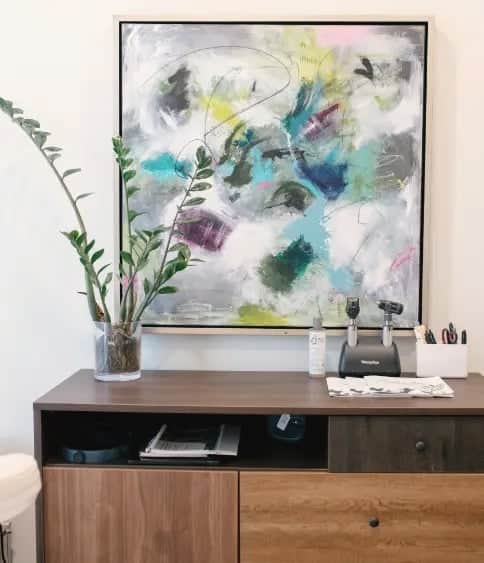 Results Medical Aesthetics waiting area with abstract art and greenery